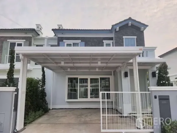Detached House for rent or sale in Prawet, Bangkok - Two-storey detached house facade with covered carport and gated entrance in Prawet, Bangkok.