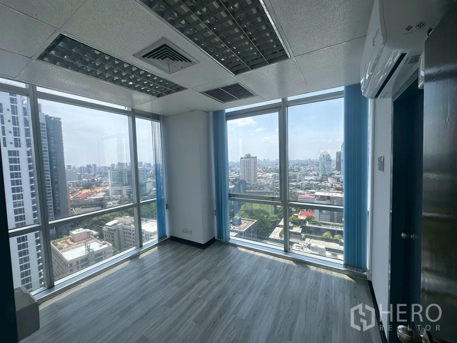 Office Space for rent - Corner office with split-type air conditioner and panoramic city views.