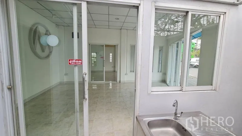 Shophouse for rent - Pantry area with stainless sink looking back into the main shop