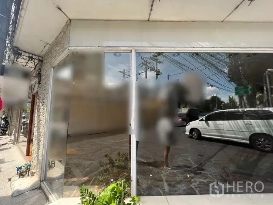 Retail Space for rent in Watthana, Bangkok - Street-level retail exterior with full-height glass facade facing a busy road.