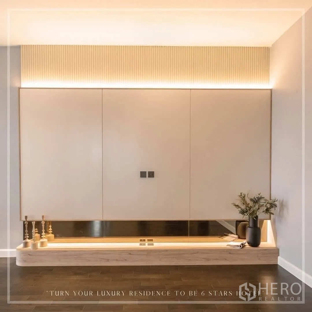 Detached House for rent or sale in Suan Luang, Bangkok - Minimalist feature wall with concealed cabinets and soft LED lighting.