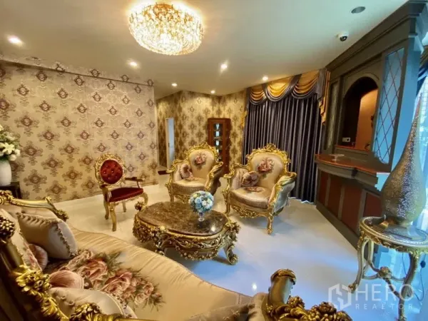 Home Office for rent or sale in Yan Nawa, Bangkok - Luxurious lounge with chandelier, ornate gold-trimmed sofa set, and patterned wallpaper.