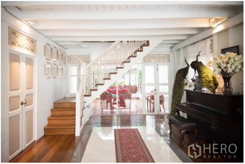 Detached House for rent in Bang Rak, Bangkok - Entrance hall featuring a staircase, piano and view toward the living room.