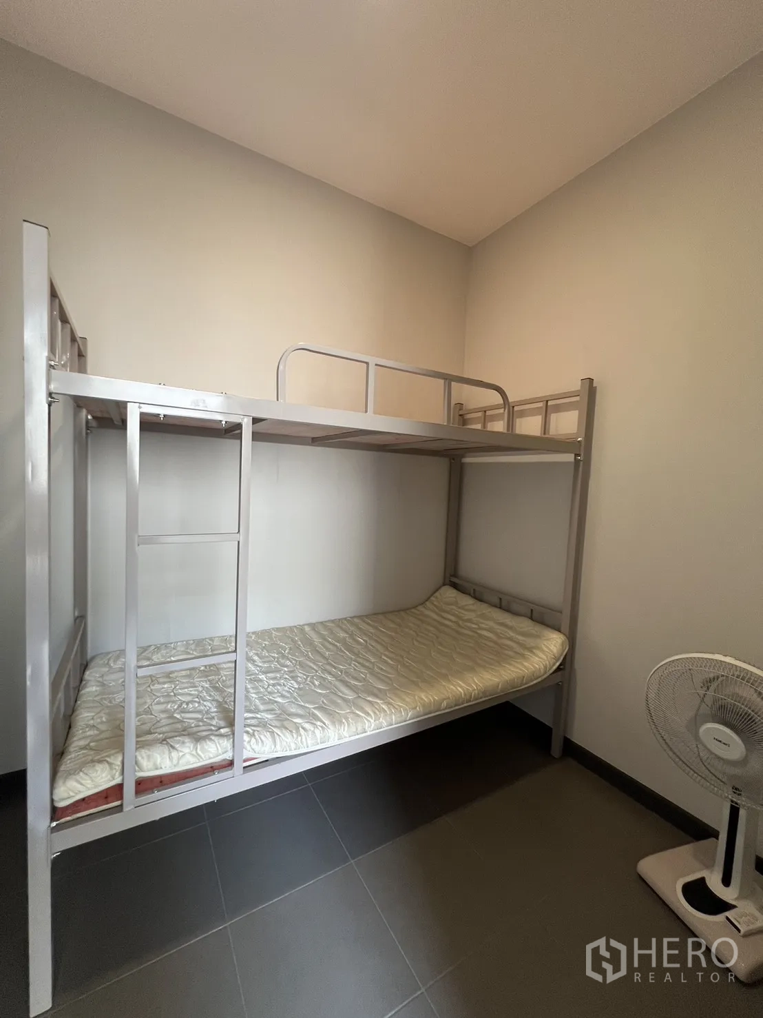 Detached House for rent in Bang Phli, Samut Prakan - Maid’s room with metal bunk bed on tiled flooring.