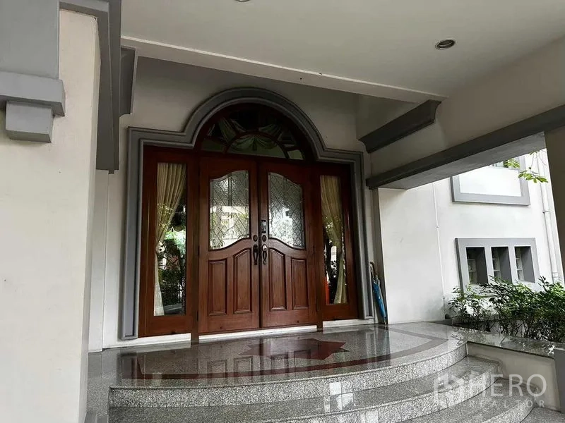 Detached House for sale in Bang Khun Thian, Bangkok - Grand entry with arched wooden double doors and polished granite steps.