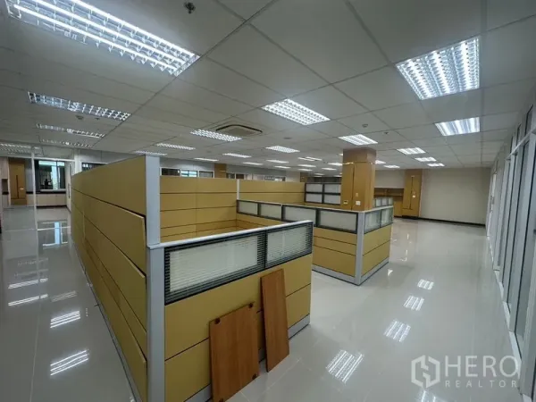 Office Space for rent in Suan Luang, Bangkok - Open-plan office with cubicle partitions, tiled floors, and LED lighting.