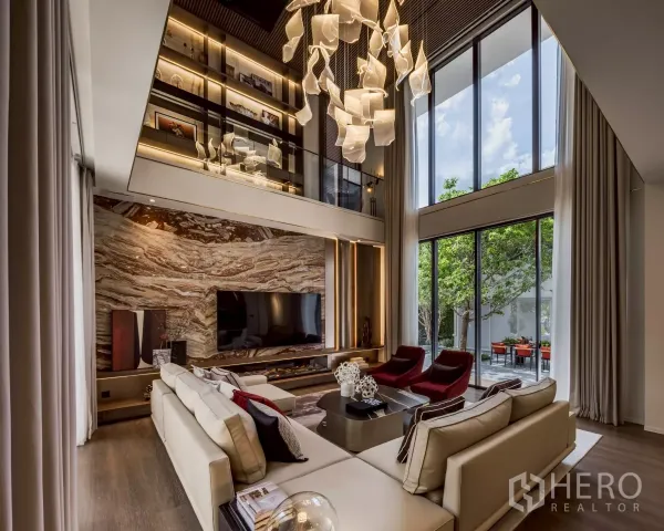 Detached House for rent in Saphan Sung, Bangkok - Luxury lounge with marble feature wall, tall windows to the courtyard and statement hanging light.
