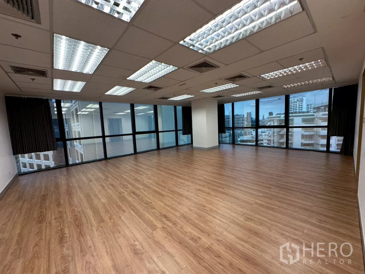 Office Space for rent in Khlong Toei, Bangkok - Generous workspace with wraparound windows and city views.