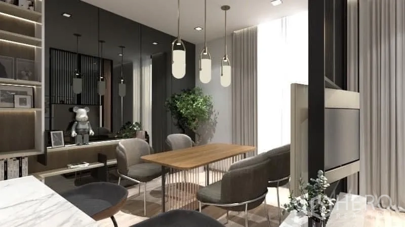 Condominium for rent in Watthana, Bangkok - Dining space with wood table, upholstered chairs and trio of pendant lights.
