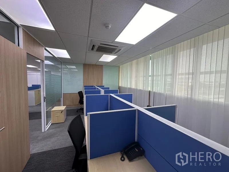 Office Space for rent - Polished elevator lobby with marble floors, stainless-steel lifts and recessed lighting.