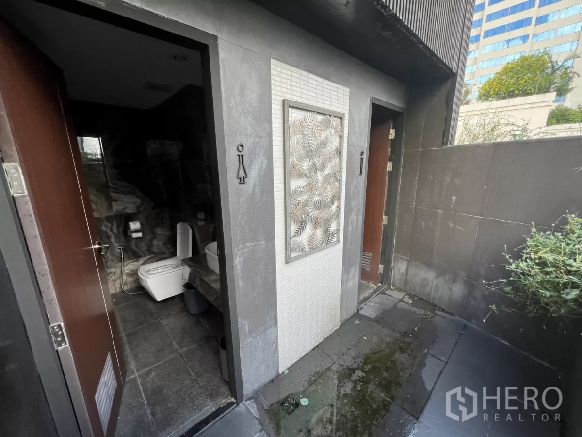 Retail Space for rent - Exterior-access male and female restrooms with tiled walls.