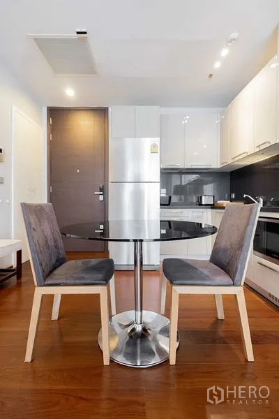 Condominium for rent - Compact dining area with round table and two chairs beside the kitchen.
