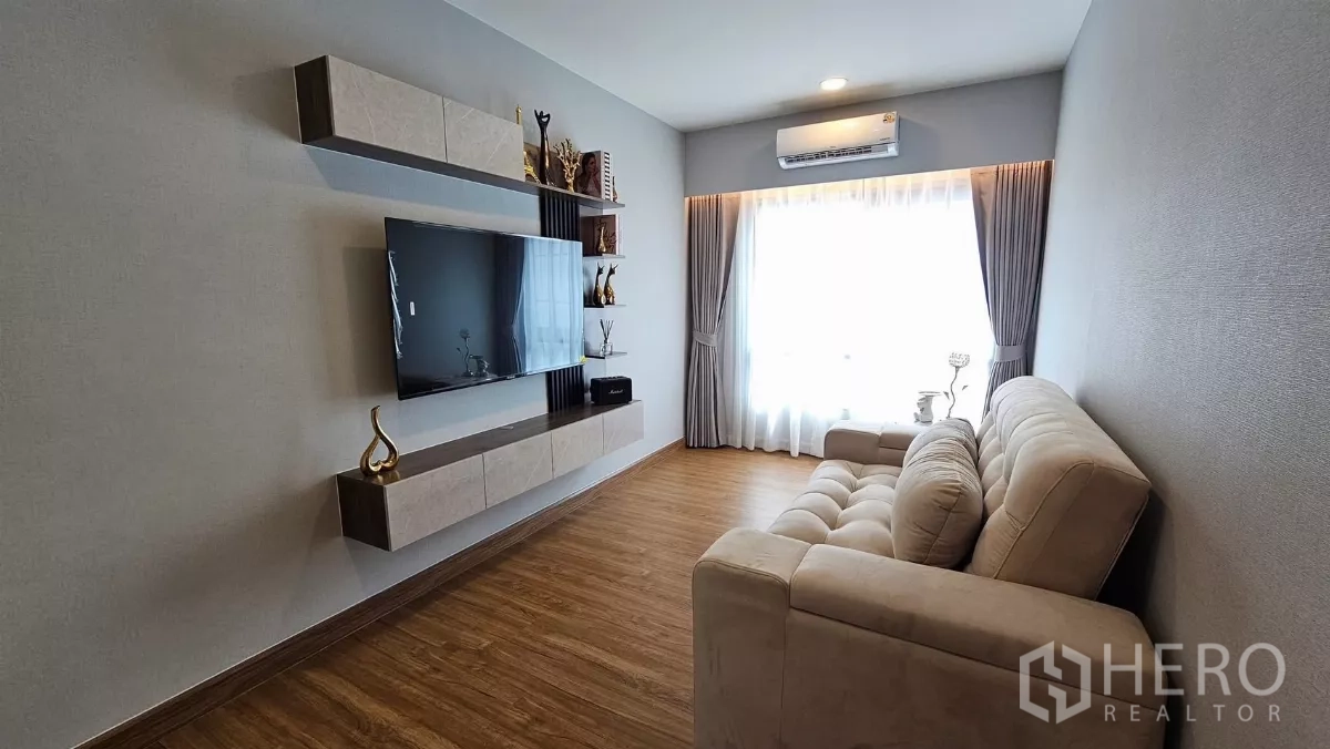 Detached House for rent or sale in Bang Phli, Samut Prakan - Upstairs lounge showing a large window with curtains, air-conditioner and soft lighting.
