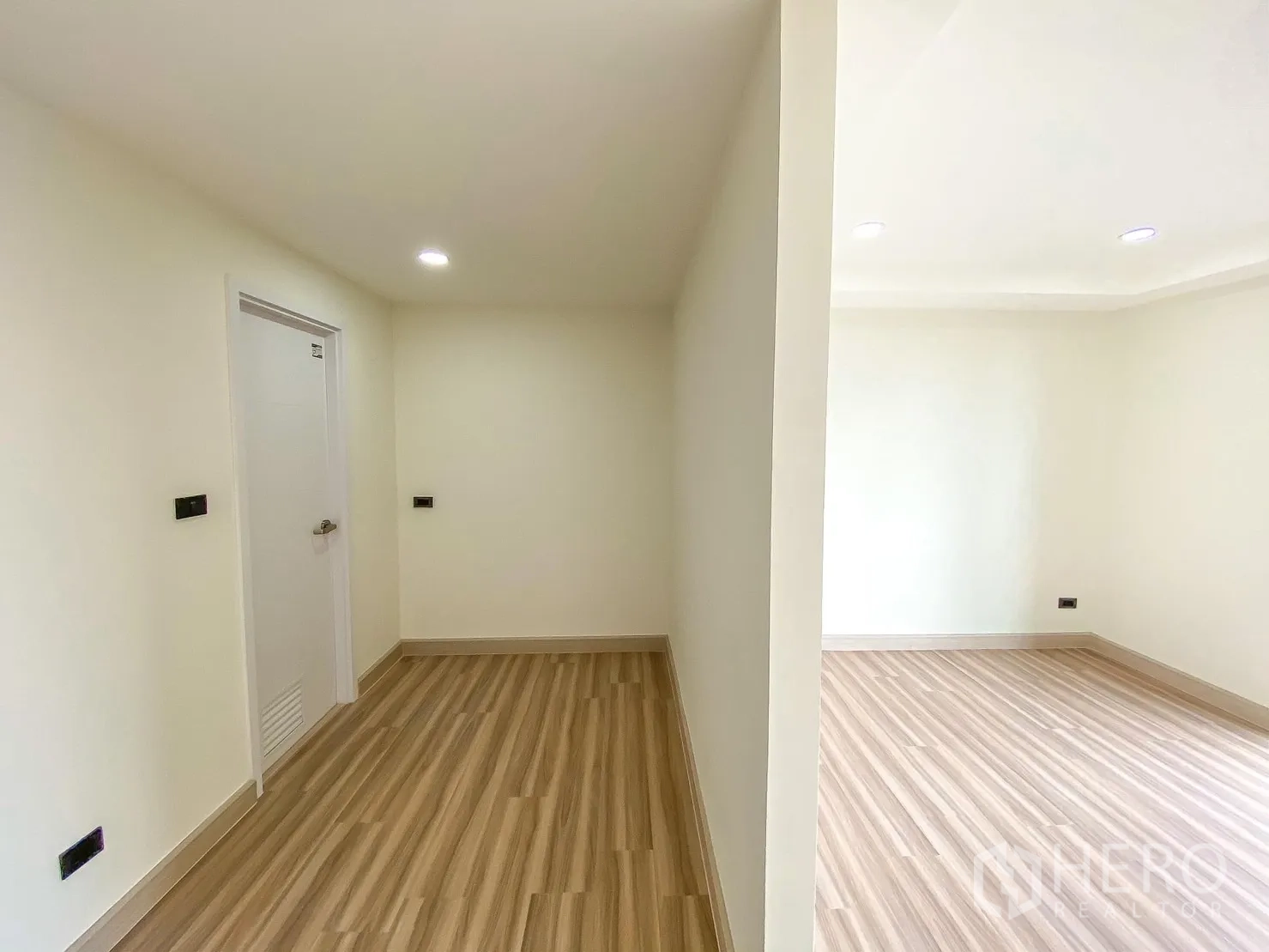 Home Office for rent or sale in Phra Khanong, Bangkok - Landing area with storage closet and adjoining room, wood floors.