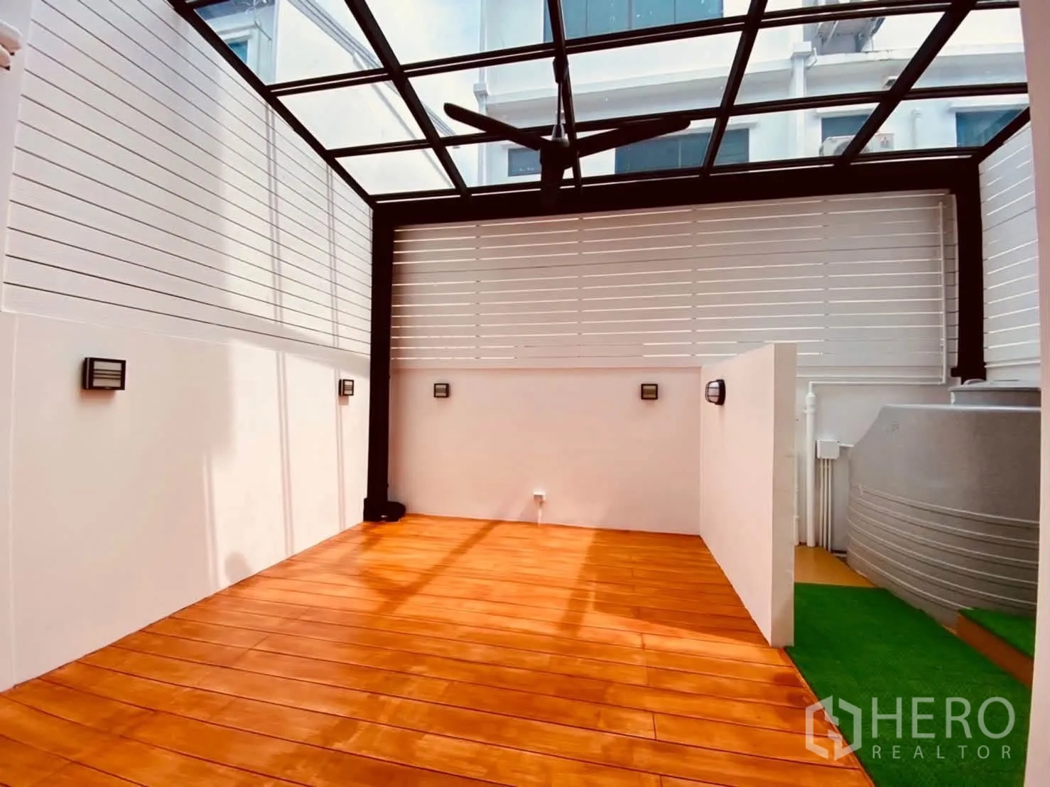 Townhouse for rent in Lat Phrao, Bangkok - Covered patio with wood deck and transparent roof.