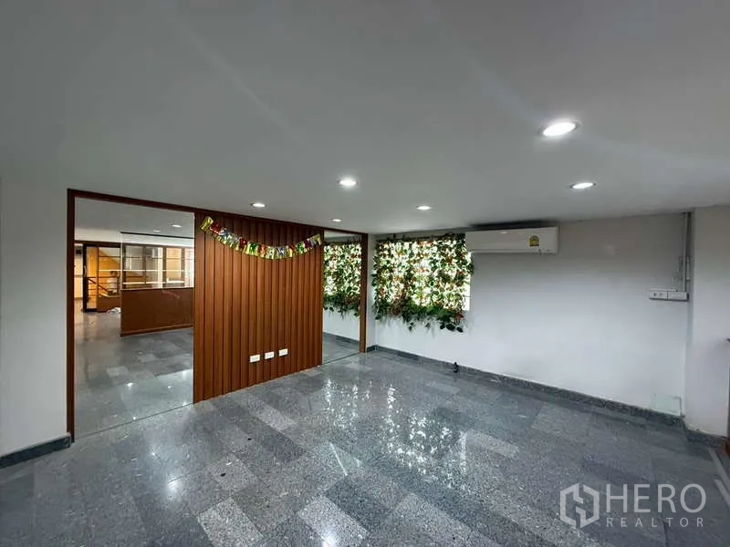 Home Office for rent in Khlong Toei, Bangkok - Bright office zone with granite flooring, wood partition wall and greenery feature, plus AC.