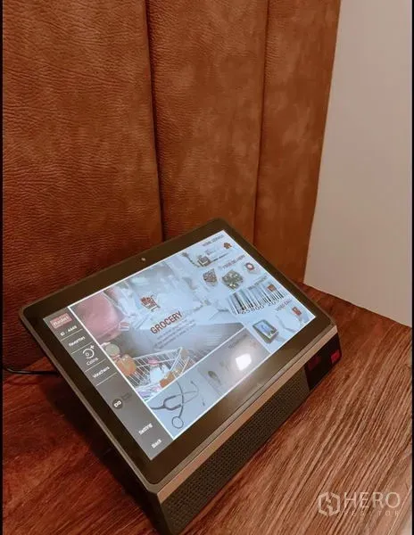 Condominium for sale in Chatuchak, Bangkok - In-room touchscreen tablet placed on a wooden side table.