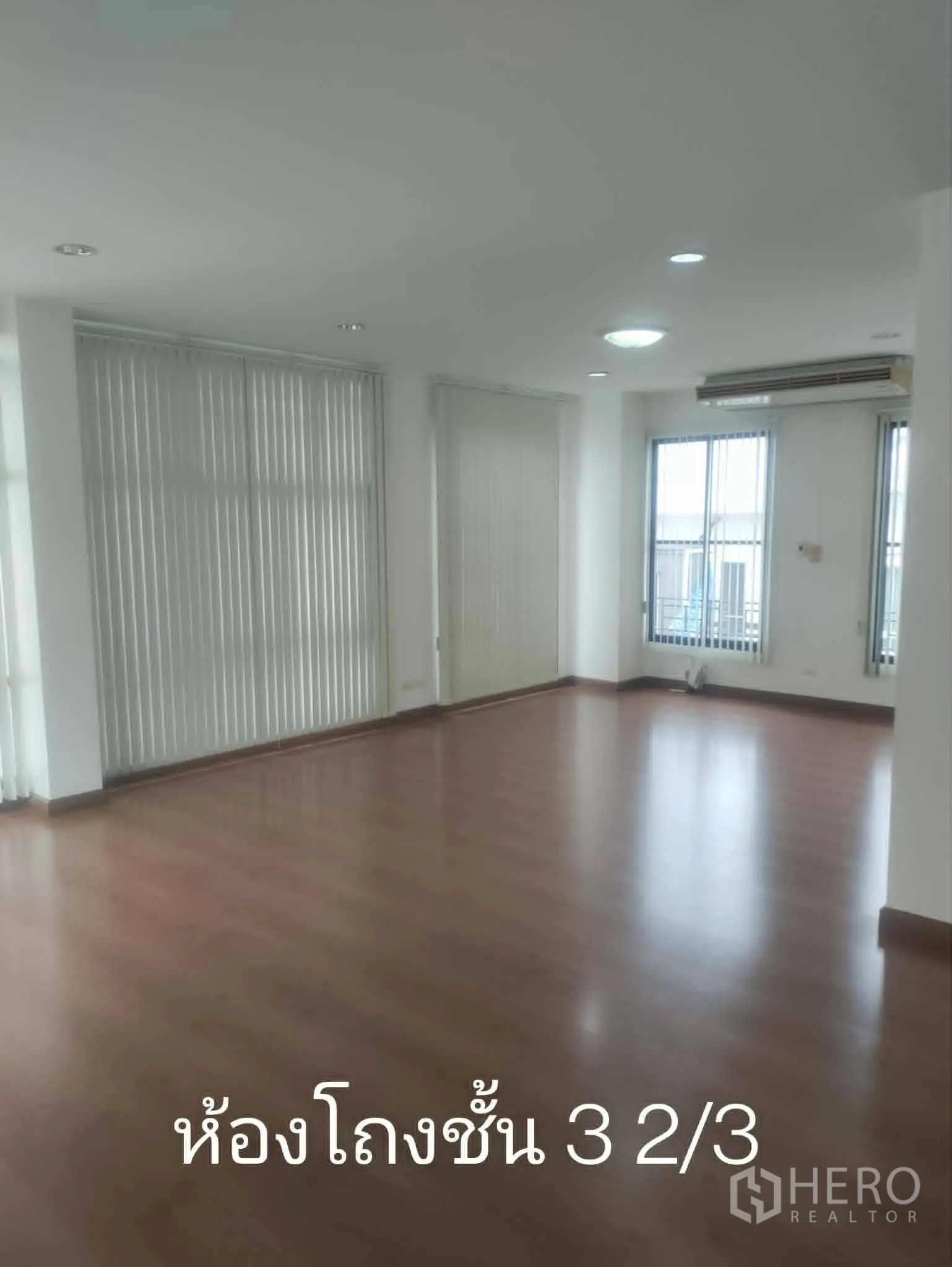 Home Office for rent in Lat Phrao, Bangkok - Large open-plan room with multiple windows and blinds.