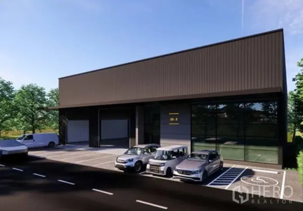 货栈 出租在Pak Kret, Nonthaburi - 带玻璃办公立面的仓库正面，设有无障碍车位及多辆车停放。