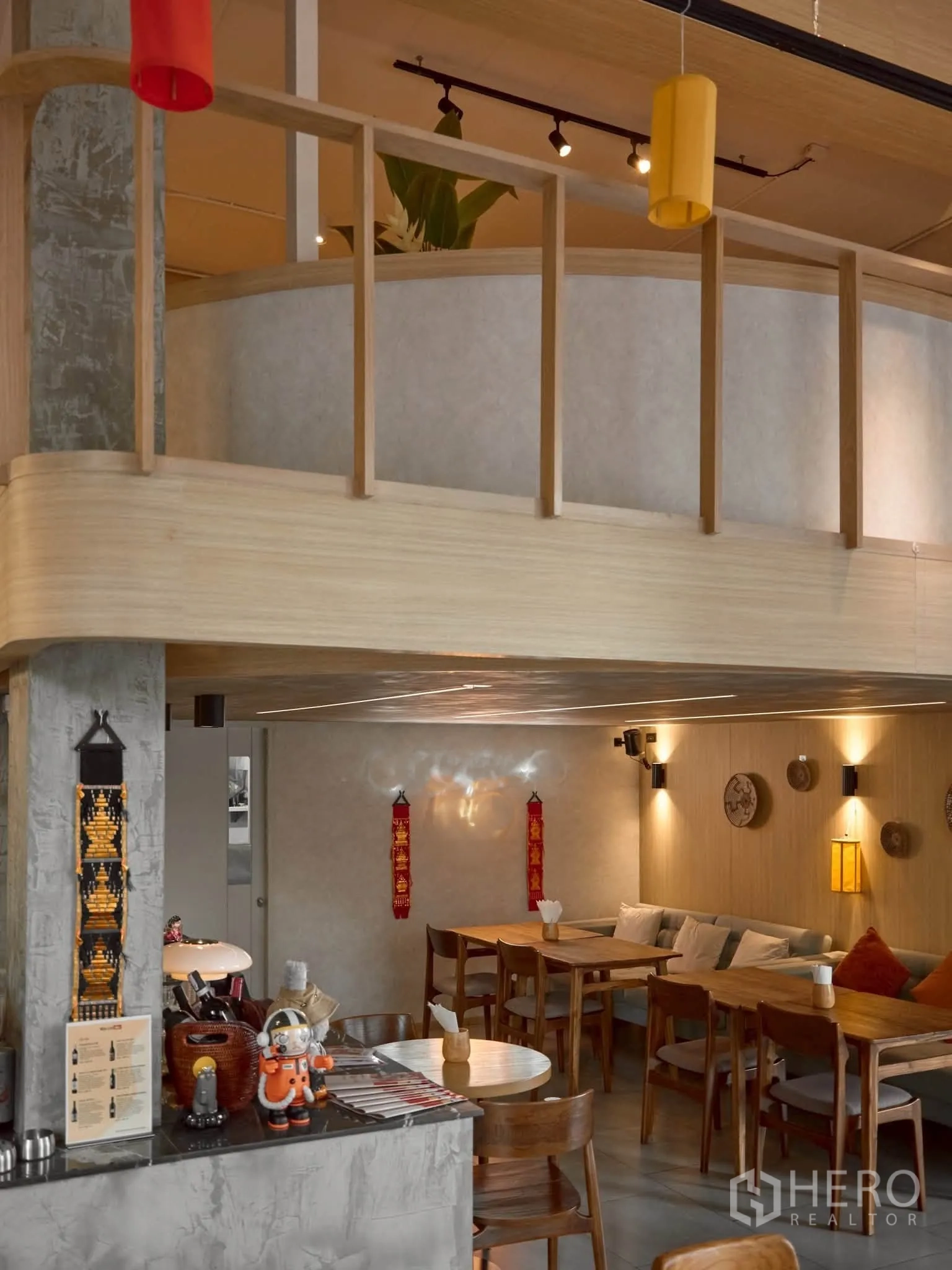 Retail Space for rent in Watthana, Bangkok - Mezzanine level and cozy dining area with wood tables and soft lighting.