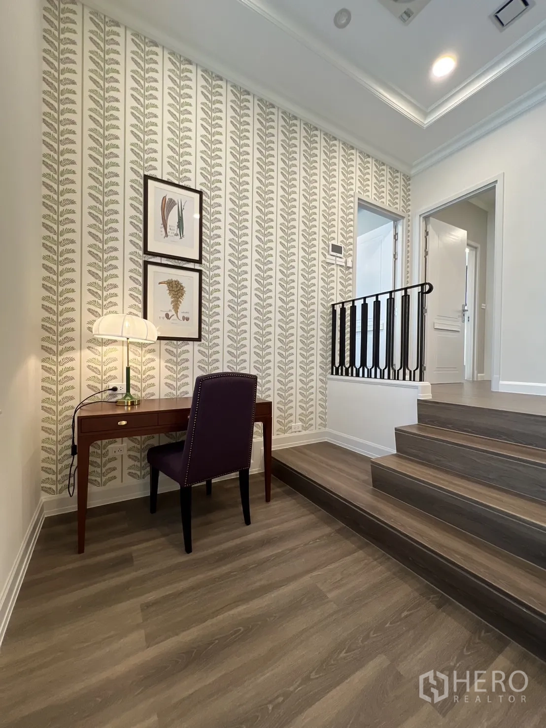 Detached House for rent in Saphan Sung, Bangkok - Upstairs landing with study nook and patterned wallpaper.