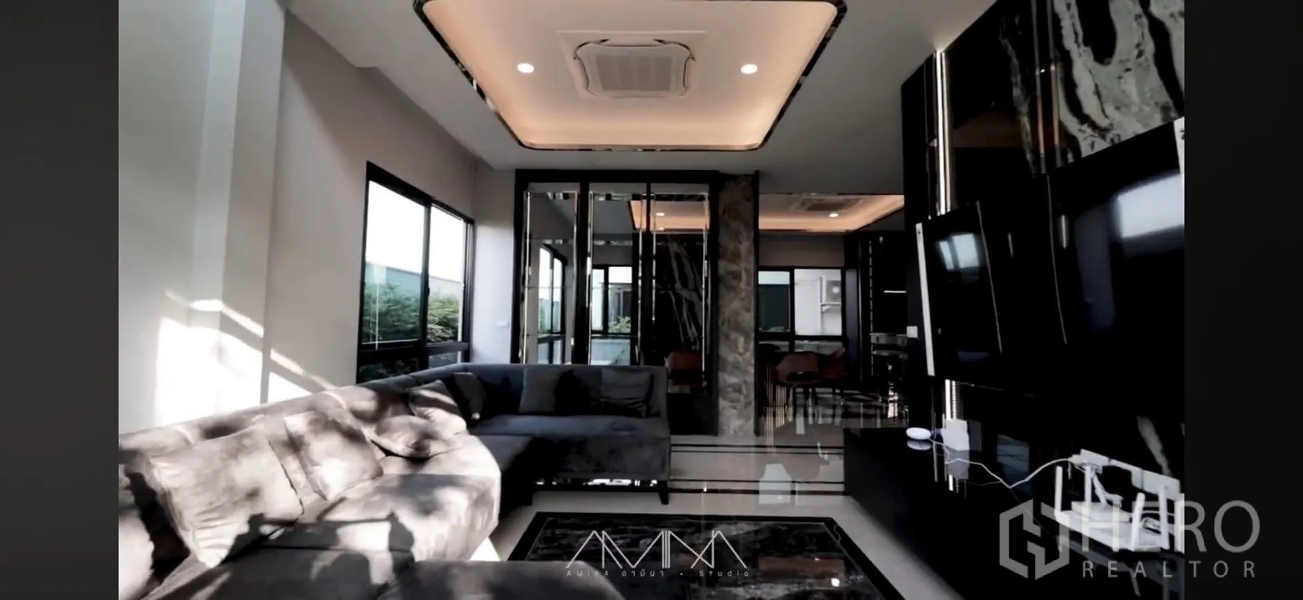 Detached House for rent in Saphan Sung, Bangkok - Living room view showing cove-lit ceiling and wide windows bringing natural light.