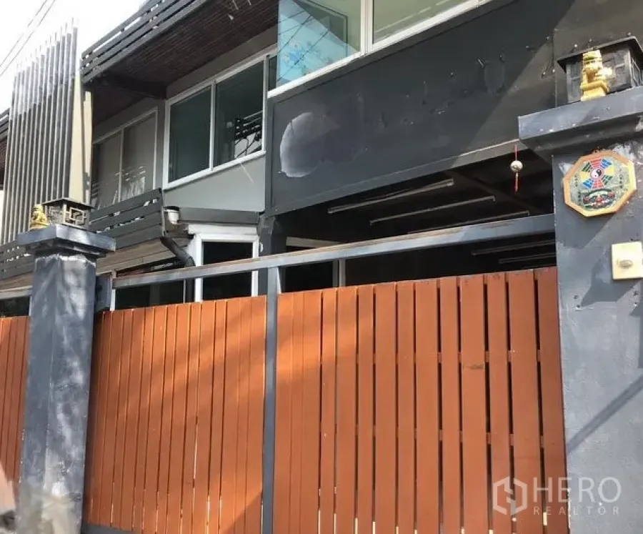 Home Office for rent in Watthana, Bangkok - Gated home office exterior with wooden slat fence and glass windows.