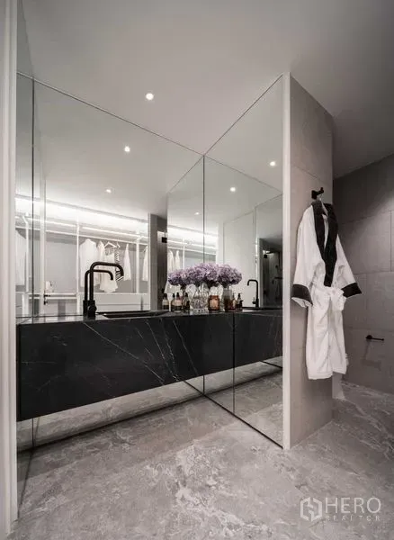 Detached House for sale in Saphan Sung, Bangkok - Luxury bathroom vanity with full-height mirrors and black marble counter.