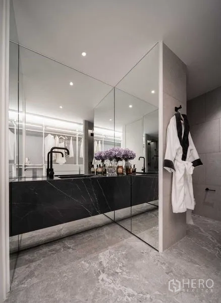Detached House for sale in Saphan Sung, Bangkok - Luxury bathroom vanity with full-height mirrors and black marble counter.