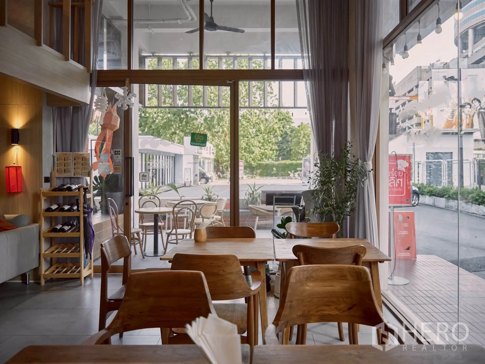Retail Space for rent in Watthana, Bangkok - Entrance area with full-height glass facade and view to outdoor seating.