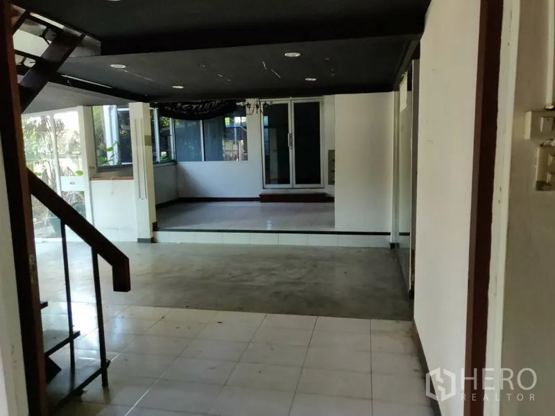 Home Office for rent in Watthana, Bangkok - Split-level interior with staircase and flexible workspace zones.