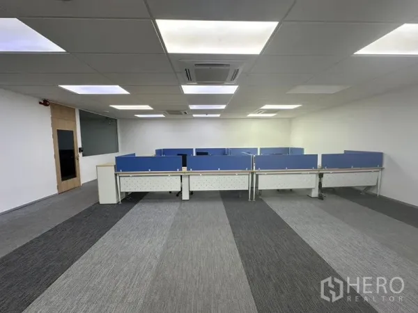 Office Space for rent - Open‑plan office in Lat Krabang with blue partition workstations, drop ceiling and air‑conditioning.