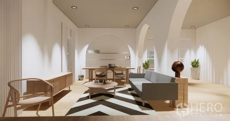 บ้าน ให้เช่าในKhlong Toei, Bangkok - โซนรับแขก–ทานอาหารแบบเปิด พรมลายก้างปลา ชั้นวางของ และไฟดาวน์ไลท์