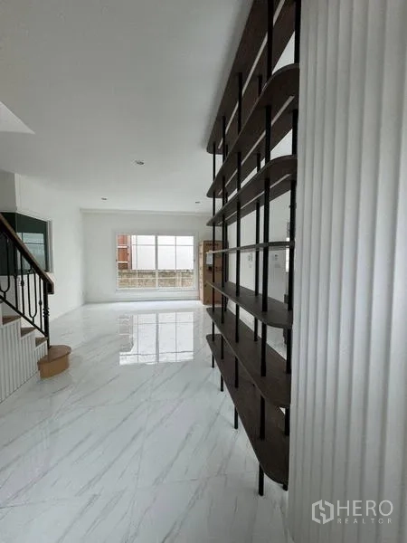 Detached House for rent - Entrance hall with feature shelving divider and staircase
