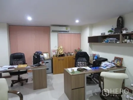 Home Office for rent or sale in Wang Thonglang, Bangkok - Executive office room with two desks, shelving and air-conditioning.