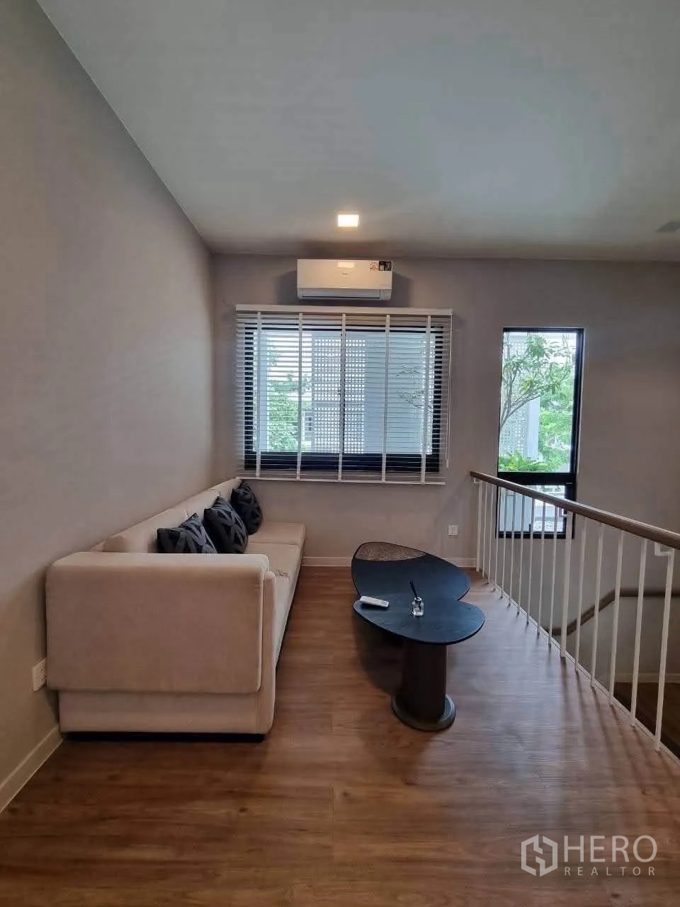 Detached House for rent in Bang Phli, Samut Prakan - Upstairs family lounge with sofa, coffee table and window by the staircase.
