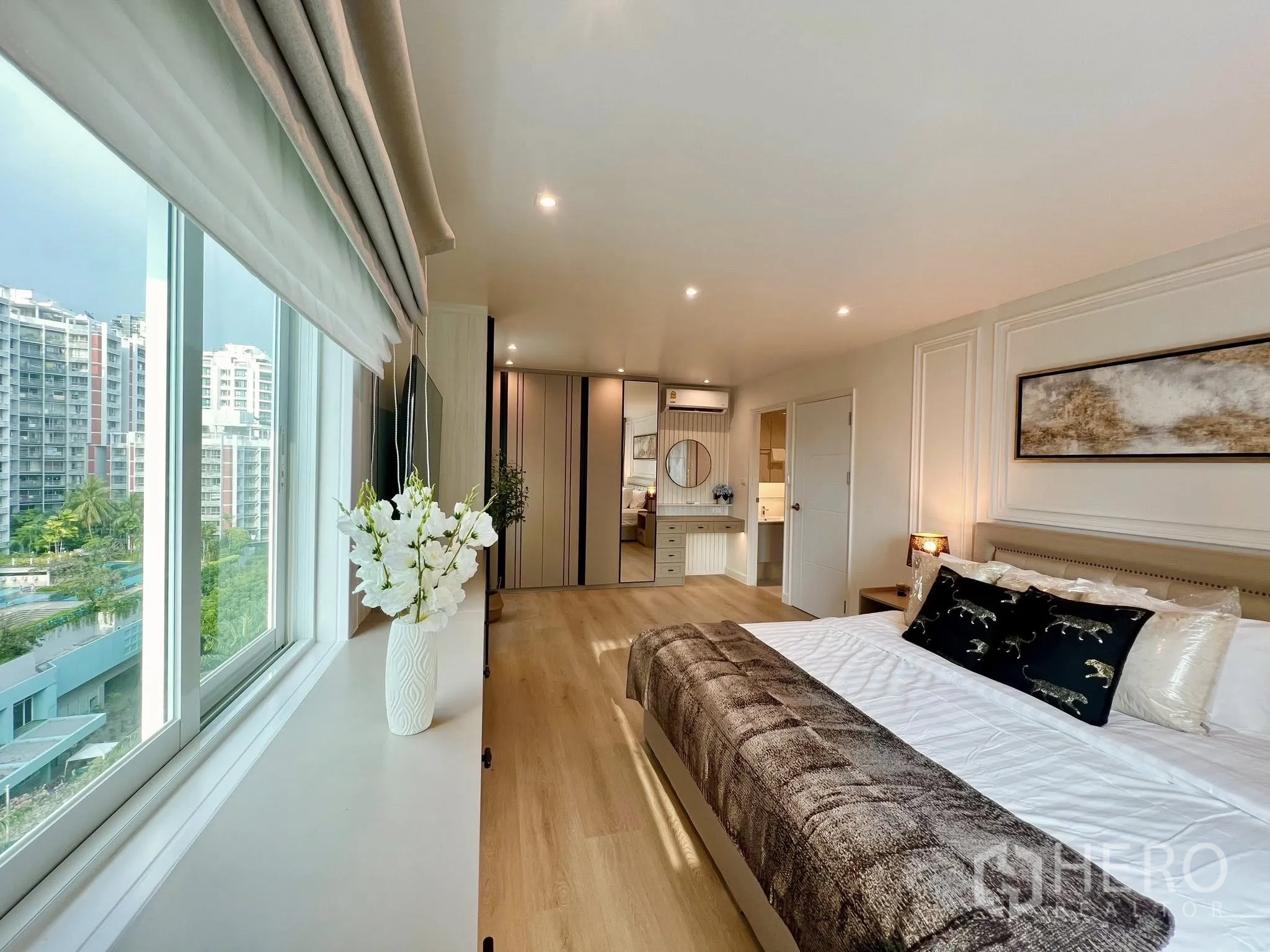 Condominium for rent or sale in Yan Nawa, Bangkok - Master bedroom with wide window and city outlook, built-in wardrobe and vanity leading to the ensuite.