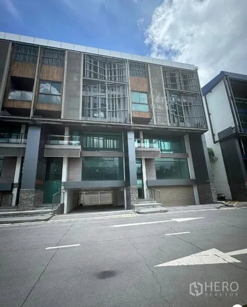 Home Office for rent or sale in Bang Phli, Samut Prakan - Front elevation of the home office building with extensive glazing.