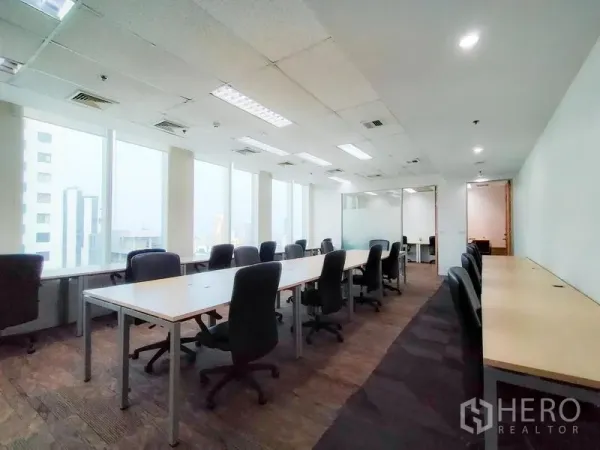 Office Space for rent in Khlong Toei, Bangkok - Large office area with glass-partition meeting room and panoramic windows.