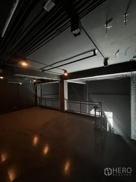 Home Office for rent or sale in Khlong Toei, Bangkok - Mezzanine level with metal railing and exposed ceiling conduits.
