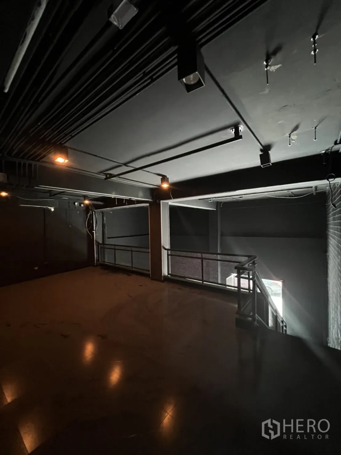 Home Office for rent or sale in Khlong Toei, Bangkok - Mezzanine level with metal railing and exposed ceiling conduits.