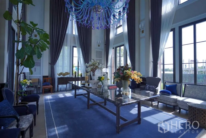 Detached House for sale in Bang Kapi, Bangkok - Formal sitting area with floor-to-ceiling windows and crystal chandelier.