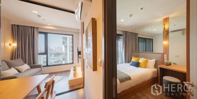 คอนโด ให้เช่าในChatuchak, Bangkok - มุมมองจากส่วนทานอาหารไปยังห้องนั่งเล่นและห้องนอนแยก พร้อมผ้าม่านเต็มสูง