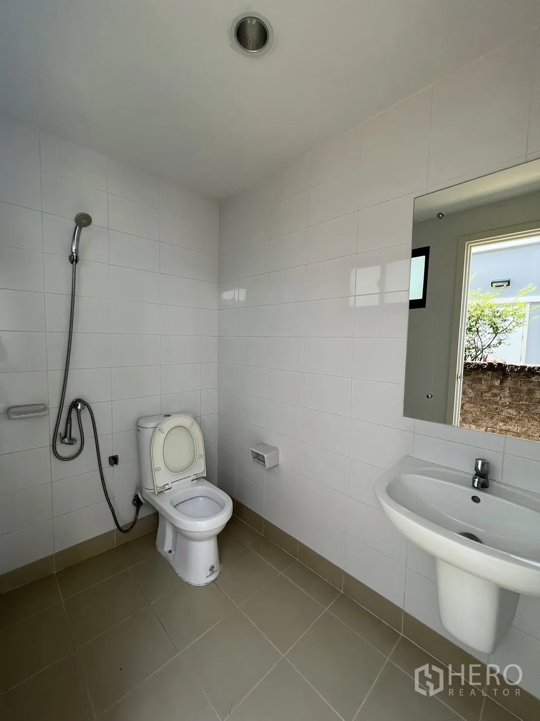 Detached House for sale in Suan Luang, Bangkok - Simple white guest or maid’s bathroom with shower set.