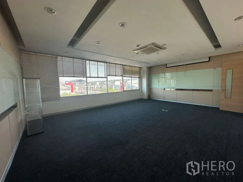Office Space for rent in Prawet, Bangkok - Spacious conference room with presentation wall, ceiling cassette AC and natural light.