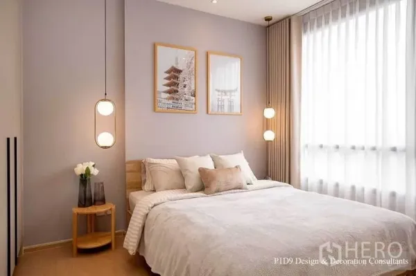 Condominium for rent in Watthana, Bangkok - Stylish bedroom with framed artwork above the bed, twin globe pendants and floor‑to‑ceiling window.