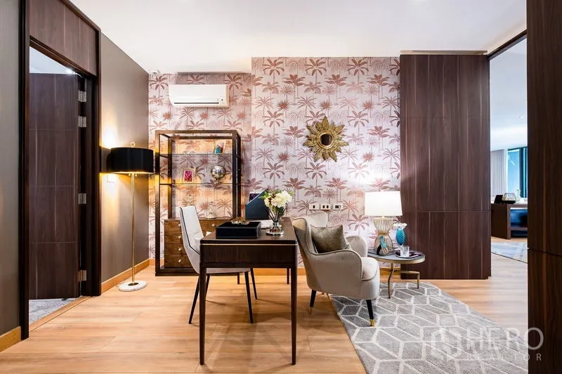 Condominium for sale - Stylish home office corner with feature wallpaper, desk, chair and open shelving.