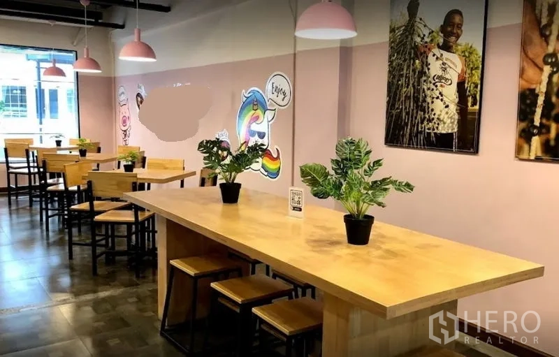 Retail Space for rent in Watthana, Bangkok - Cafe-style seating with a long communal table, pendant lights and playful wall art.