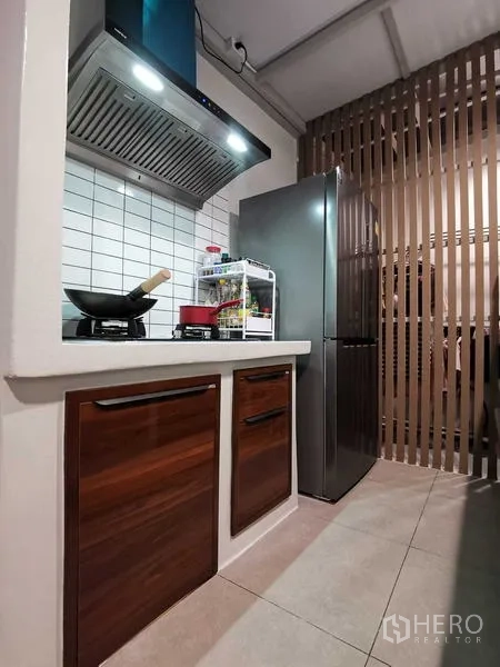 Home Office for rent or sale - Compact kitchen with tiled backsplash, range hood, refrigerator and wood cabinetry.