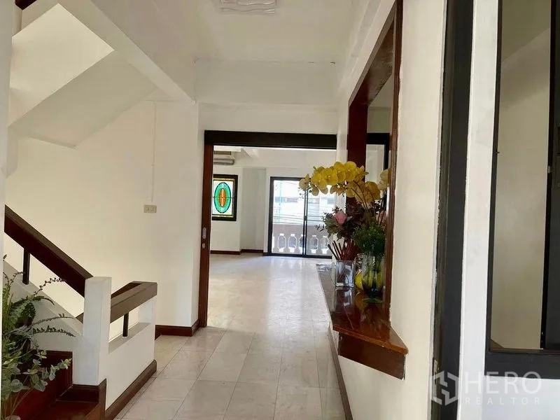 Home Office for rent - Entry hall with staircase, tiled floor and view toward sliding balcony doors.
